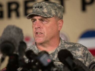 Lt. Gen. Mark Milley, the senior officer on base, speaks with the media outside of an entrance to the Fort Hood military base following a shooting that occurred inside. AP 