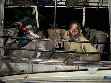 Injured Police and polling officials after suspected Maoists attack at Sikaripara in Dumka of Jharkhand on Thursday. PTI.