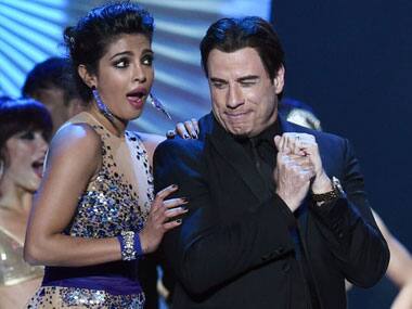 Travolta shakes a leg with Priyanka Chopra at the IIFA awards. AFP