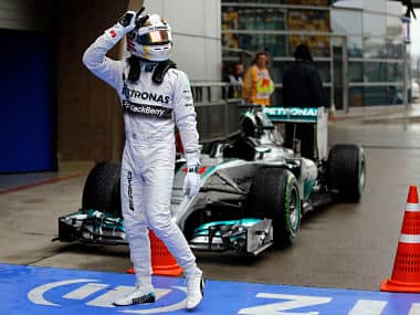 Mercedes Formula One driver Lewis Hamilton of Britain gestures while celebrating after taking pole position at the qualifying session of the Chinese F1 Grand Prix. Reuters 