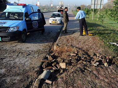 Investigators at the location of the bomb in Islamabad, Pakistan. AFP