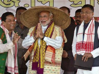 Narendra Modi is all smiles with the new hat. PTI
