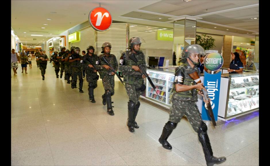 Soldiers patrol a shopping center in the city center during a police strike in Salvador, Bahia state, April 17, 2014. A police strike has unleashed violent crime in Brazil's third-largest city just two months before it is set to welcome hordes of soccer fans for the World Cup, adding to fears about the country's ability to ensure safety during the event. At least 22 people were killed in and around the northeastern city of Salvador after state police went on strike early on Wednesday to demand better pay and other benefits, the Bahia state government said on Thursday, prompting the federal government to dispatch troops to restore order. REUTERS