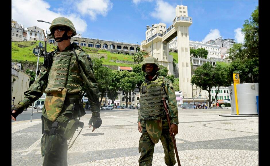 Soldiers patrol the city center during a police strike in Salvador, Bahia state, April 17, 2014. A police strike has unleashed violent crime in Brazil's third-largest city just two months before it is set to welcome hordes of soccer fans for the World Cup, adding to fears about the country's ability to ensure safety during the event. At least 22 people were killed in and around the northeastern city of Salvador after state police went on strike early on Wednesday to demand better pay and other benefits, the Bahia state government said on Thursday, prompting the federal government to dispatch troops to restore order. REUTERS