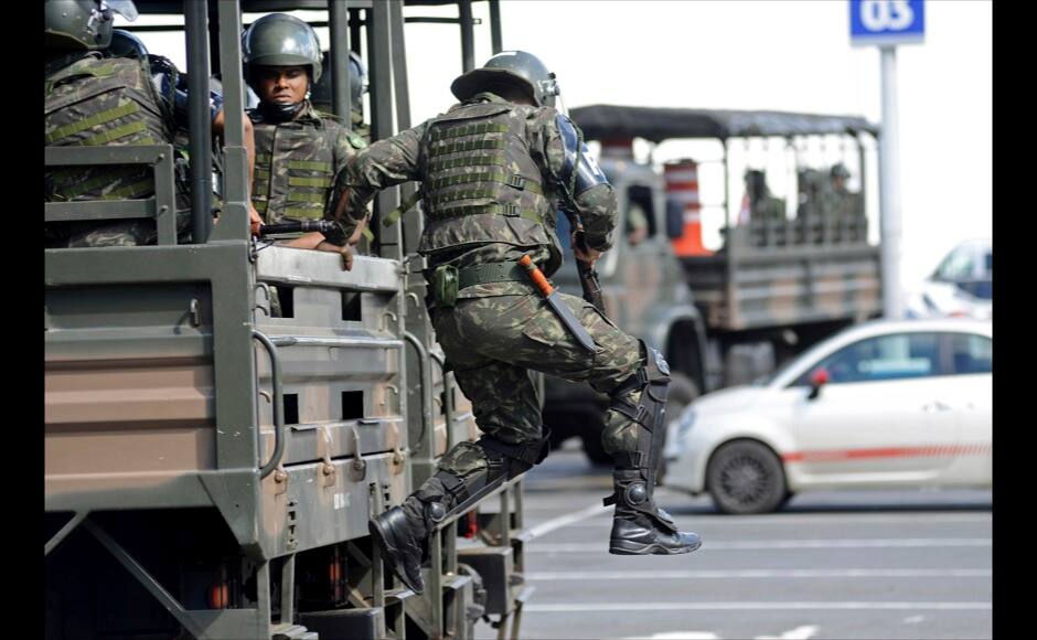 Soldiers are deployed in the city center to prevent looting during a police strike in Salvador, Bahia state, April 17, 2014. A police strike has unleashed violent crime in Brazil's third-largest city just two months before it is set to welcome hordes of soccer fans for the World Cup, adding to fears about the country's ability to ensure safety during the event. At least 22 people were killed in and around the northeastern city of Salvador after state police went on strike early on Wednesday to demand better pay and other benefits, the Bahia state government said on Thursday, prompting the federal government to dispatch troops to restore order. REUTERS
