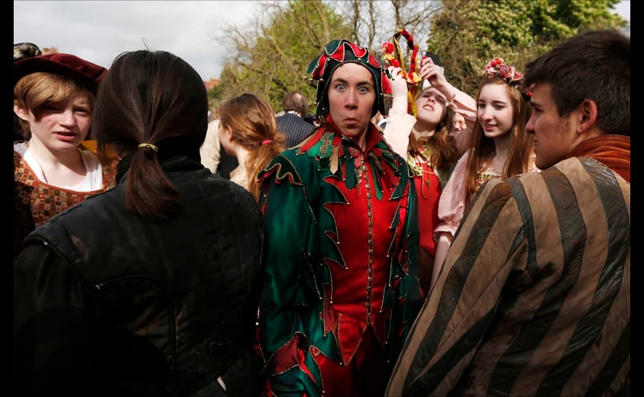 Performers from the Royal Shakespeare Company wait for the start of a procession marking the 450th anniversary of William Shakespeare's birth in Stratford-upon-Avon, southern England April 26, 2014. Shakespeare's birthplace of Stratford-upon-Avon is hosting a weekend of festivities in celebration of their famous son who was regarded as England's greatest playwright. REUTERS/Suzanne Plunkett 