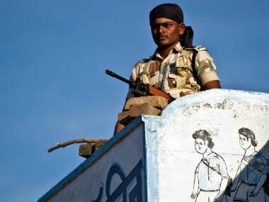 A security personnel at the polling booth. AFP