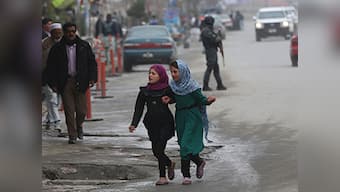 Afghans defy Taliban threat, line up to vote for new leader