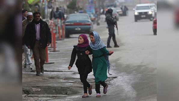 Afghans defy Taliban threat, line up to vote for new leader