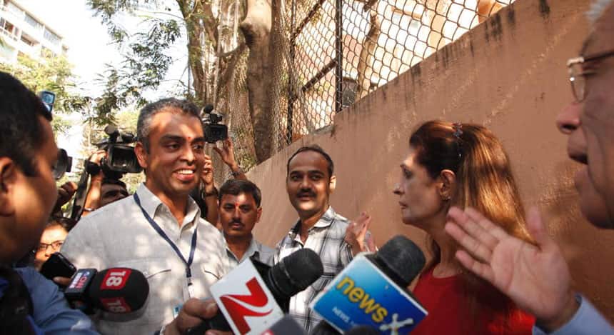 Deepak Parekh of HDFC not allowed to vote inspite of coming with his passport because his name was not there on the voting list but he still meets Congress candidate from South Bombay Milind Deora to lend his support. Photo by Mexy Xavier/Firstpost 