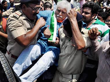 Police detain Congress candidate Madhusudan Mistry. PTI