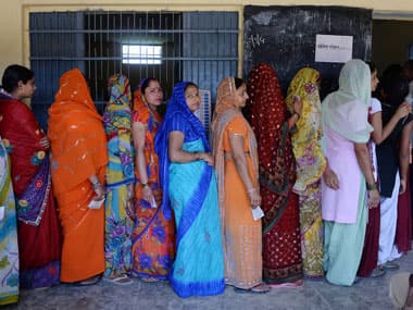 Voters queue up at a polling booth. AFP.
