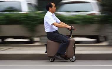 Photos: Man puts his baggage to good use, turns it into a scooter