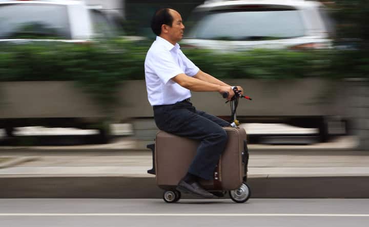 Photos: Man puts his baggage to good use, turns it into a scooter