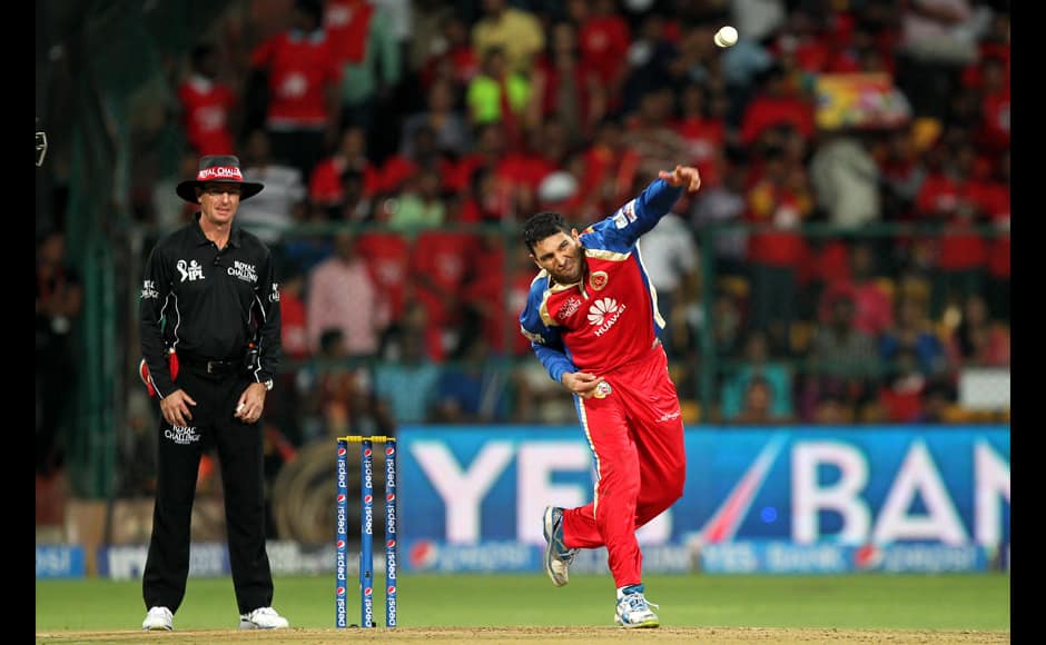 Yuvraj Singh of the Royal Challengers Banglore bowls during match 38 of the Pepsi Indian Premier League Season 2014 between the Royal Challengers Bangalore and the Delhi Daredevils held at the M. Chinnaswamy Stadium, Bangalore, India on the 13th May 2014Photo by Prashant Bhoot / IPL / SPORTZPICS
