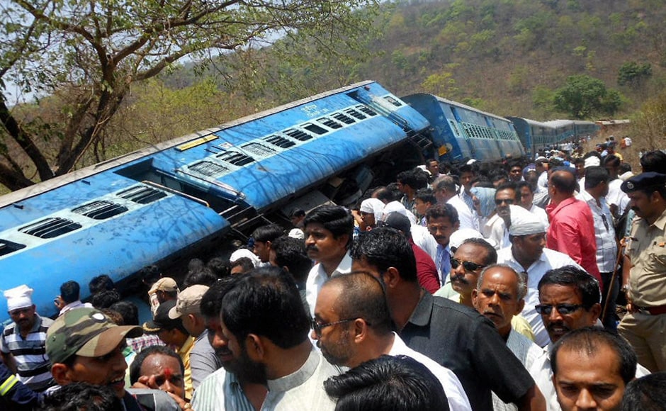 People gather near the passenger train accident site which derailed at Nagothane in Raighad district, Maharashtra on Sunday. PTI People gather near the passenger train accident site which derailed at Nagothane in Raighad district, Maharashtra on Sunday. PTI