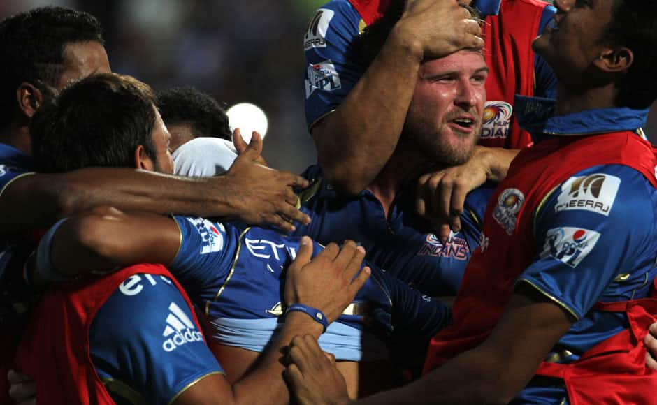 Mumbai Indians players celebrate after winning the match 56 of the Pepsi Indian Premier League Season 2014 between the Mumbai Indians and the Rajasthan Royals held at the Wankhede Cricket Stadium, Mumbai, India on the 25th May 2014 Photo by Vipin Pawar / IPL / SPORTZPICS