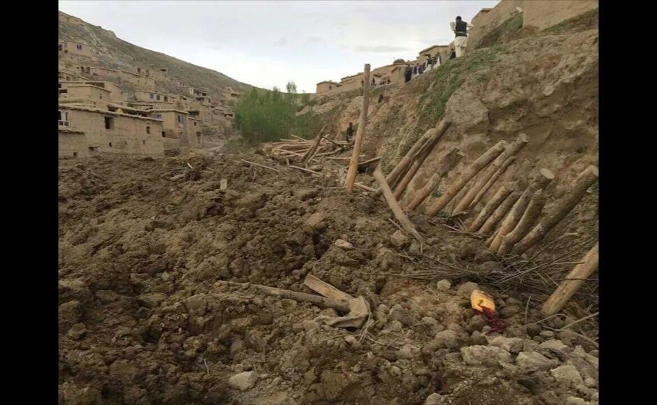 Afghans search for survivors after a massive landslide landslide buried a village Friday, May 2, 2014 in Badakhshan province, northeastern Afghanistan, which Afghan and U.N. officials say left hundreds of dead and missing missing.(AP Photo/Ahmad Zubair)