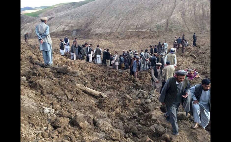 Afghans search for survivors after a massive landslide landslide buried a village Friday, May 2, 2014 in Badakhshan province, northeastern Afghanistan, which Afghan and U.N. officials say left hundreds of dead and missing missing.(AP Photo/Ahmad Zubair)