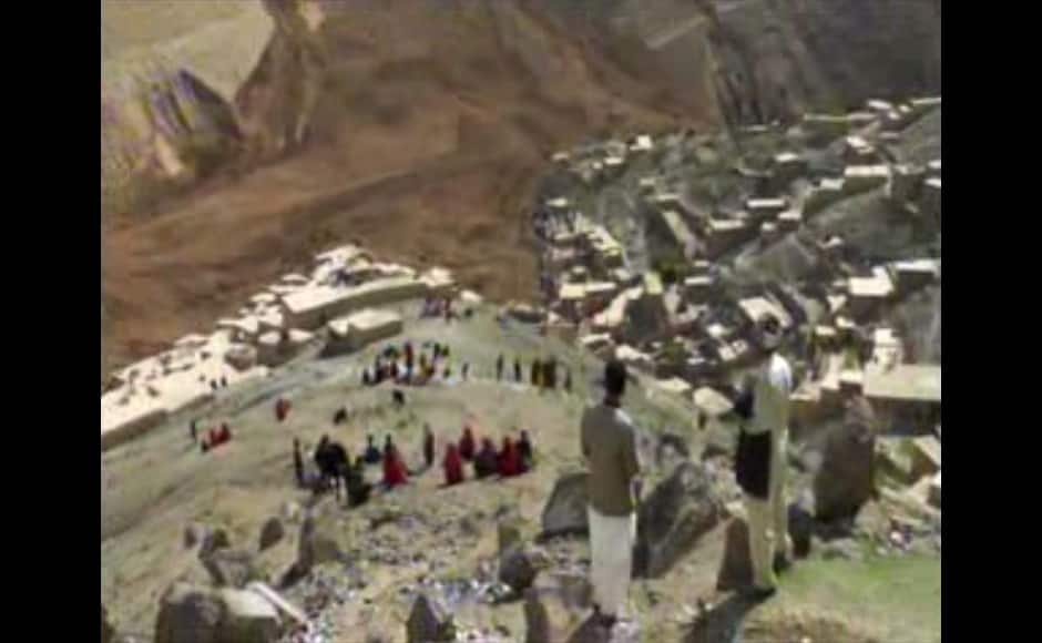 This image made from AP video shows people searching for survivors after a massive landslide landslide buried a village Friday, May 2, 2014 in Badakhshan province, northeastern Afghanistan, which Afghan and U.N. officials say left hundreds of dead and missing missing. (AP Photo via AP video)