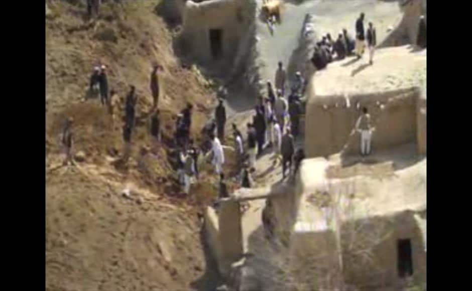 This image made from AP video shows people searching for survivors after a massive landslide landslide buried a village Friday, May 2, 2014 in Badakhshan province, northeastern Afghanistan, which Afghan and U.N. officials say left hundreds of dead and missing missing. (AP Photo via AP video)