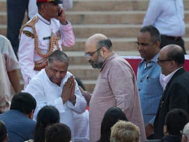 Amit Shah is seen along with Mulayam Singh Yadav at the swearing-in ceremony. AP 