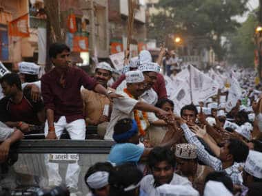 Arvind Kejriwal surrounded by a sea of supporters during his election campaign in Varanasi. AP 