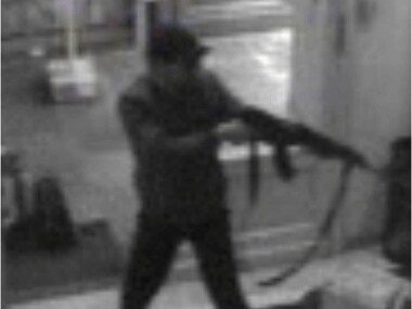 A surveillance camera shows a man shooting at the Jewish museum. AP A surveillance camera shows a man shooting at the Jewish museum. AP