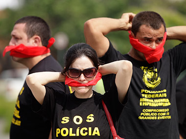 Brazil's Federal Police want pay hike, threaten World Cup strike Brazil's Federal Police want pay hike, threaten World Cup strike