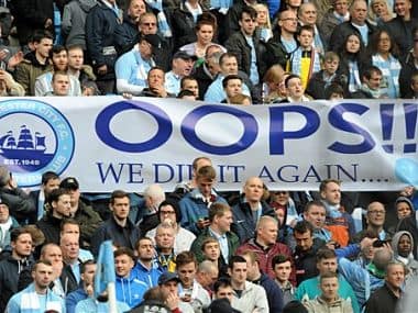 Manchester City fans celebrate after Manchester City are crowned Premier League Champions. AP