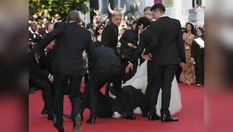 Cannes 2014: Man uses actress' dress as cover to hide from security