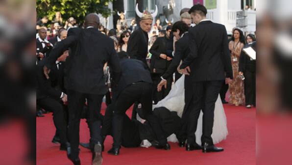 Cannes 2014: Man uses actress' dress as cover to hide from security