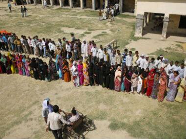 File photo of voters standing in line to cast their vote in UP. AP