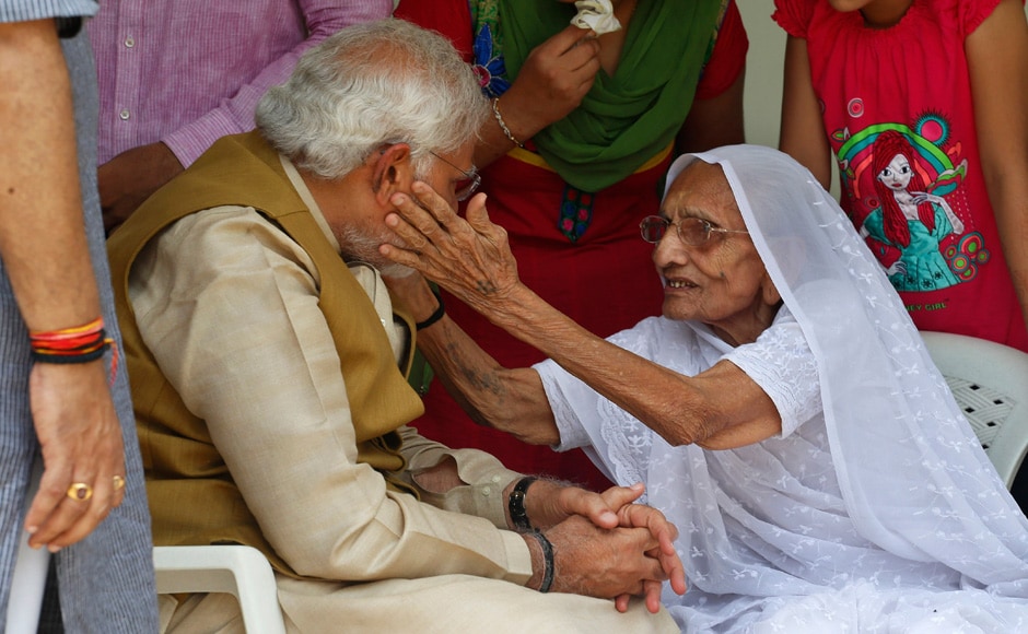 Narendra Modi sits with his 90-year-old mother Hiraben during a visit to seek her blessings after preliminary results showed his party winning by a landslide. Saurabh Das/AP Narendra Modi sits with his 90-year-old mother Hiraben during a visit to seek her blessings after preliminary results showed his party winning by a landslide. Saurabh Das/AP