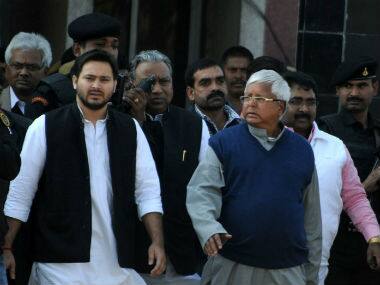 Lalu Prasad Yadav with his son Tejaswini Yadav in this file photo. AFP 