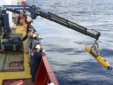 The Bluefin-21 mini sub being lowered into the waters: AP