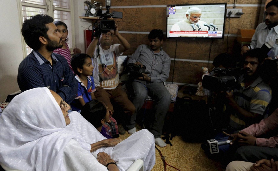 Hiraba, the proud mother of Narendra Modi, look at the live telecast of her son's swearing-in. PTI