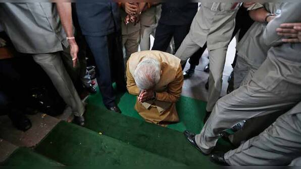 Image of the day: India's PM-elect, Narendra Modi, bows in front of Parliament 