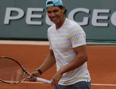 Rafael Nadal enjoys himself while practising at Roland Garros. AP
