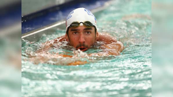 Swimming: Phelps steps up comeback with 100 butterfly win