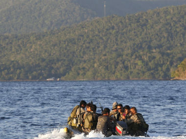Unidentified gunmen take hostages; abduct 3 foreigners, Filipino from Philippine resort Unidentified gunmen take hostages; abduct 3 foreigners, Filipino from Philippine resort