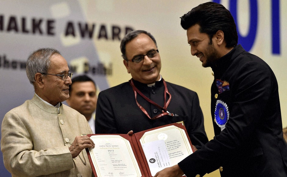 President Pranab Mukherjee presents Special Jury award (Shared) to actor Riteish Deshmukh for his Marathi production film ''Yellow'' during the 