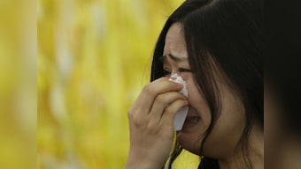 Haunted by South Korea ferry disaster, survivors back at school 