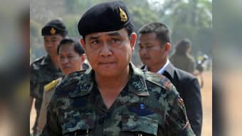 Day after coup, Thai army chief summons ousted PM for talks