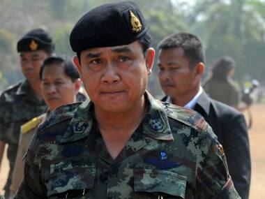 Day after coup, Thai army chief summons ousted PM for talks
