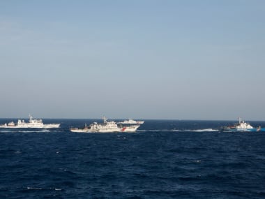 A ship of Vietnam Marine Guard is seen near Chinese vessels in the South China Sea. Reuters