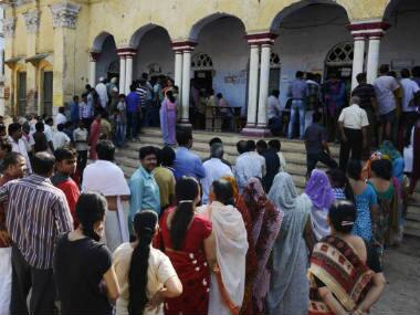 Voters line up to cast their vote in Varanasi. AFP 