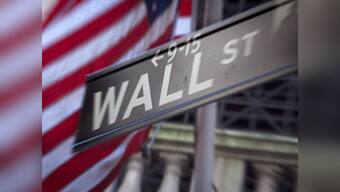 Dow ends at record high as Fed upbeat on US economy