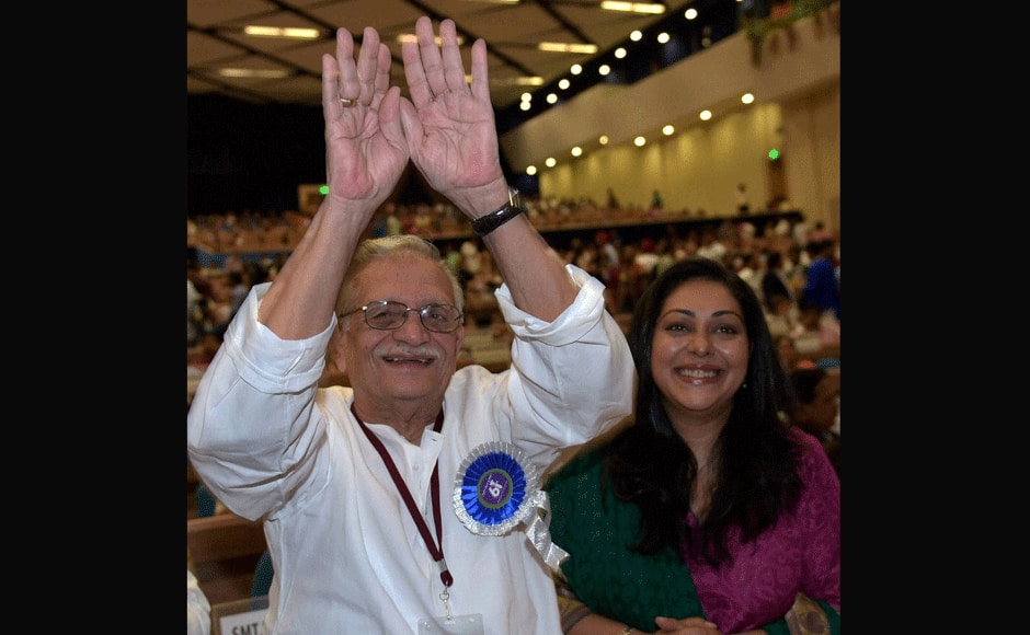 Dadasaheb Phalke Award winner Film-maker,Lyricist and author Gulzar gestures as his daughter Meghna Gulzar looks on during the 61st National Film Awards 2013 function in New Delhi on Saturday. PTI