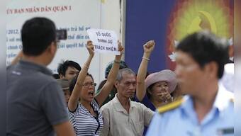 Vietnam stops anti-China protests after deadly riots, China evacuates